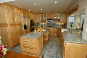 Kitchen Remodel Lake Forest with wood cabinets, granite counter tops, tile floor