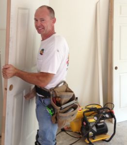 DAD installing Door